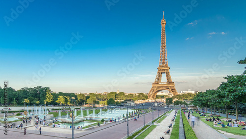Sunset view of Eiffel Tower timelapse with fountain in Jardins du Trocadero in Paris, France.