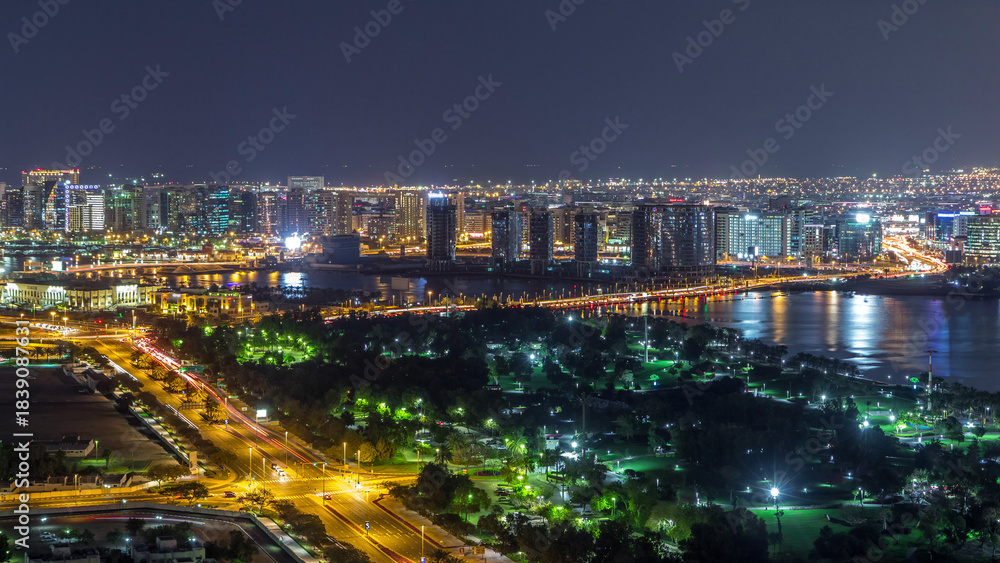 Obraz premium View of lights from illuminated roads and windows in luxury Dubai city, United Arab Emirates Timelapse Aerial