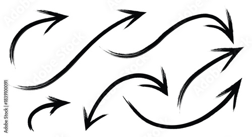 Set of hand drawn brush stroke arrows pointing in different directions