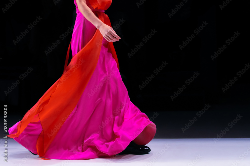 Obraz premium Elegant long pink red silk dress, woman's chic bright outfit