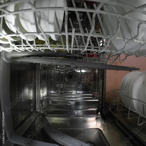 Dishwasher inside view dirty dish rack slides in square video