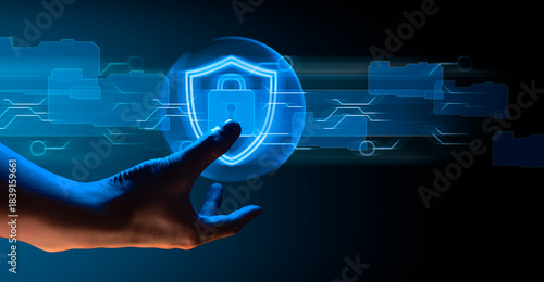 hand of businessman interactive touching a holographic anti-virus security shield system network and technology, success of innovation