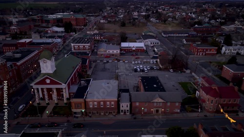 Christmas lights shine bright in Charles Town aerial, West Virginia at dusk. The town shows its holiday spirit with festive decorations.