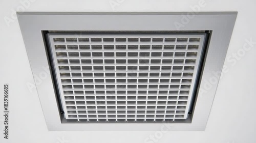 Square White Plastic Air Vent Grille with Grid Pattern on a White Ceiling ventilation HVAC