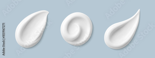 Cosmetic smears of creamy texture isolated on blue background. Set of cosmetic cream swatches. Cosmetic skin care product. Vector realistic illustration