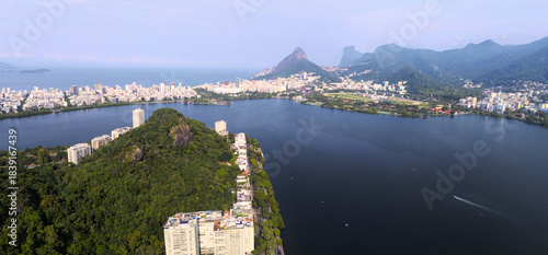 Aerial view of Rodrigo de Freitas Lagoon mirroring the city's skyline against the backdrop of Sugarloaf Mountain, Rio de Janeiro, State of Rio de Janeiro, Brazil.