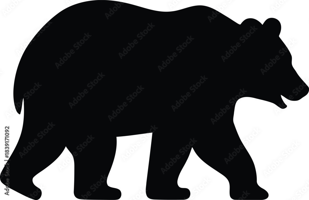 Fototapeta premium Black silhouette of a large bear walking across flat surface