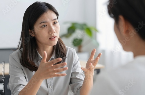 Wallpaper Mural two businesswomen talking in office Torontodigital.ca