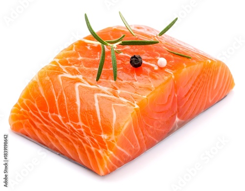 Bright orange salmon fillet glistens, topped with rosemary and peppercorns, on a white surface