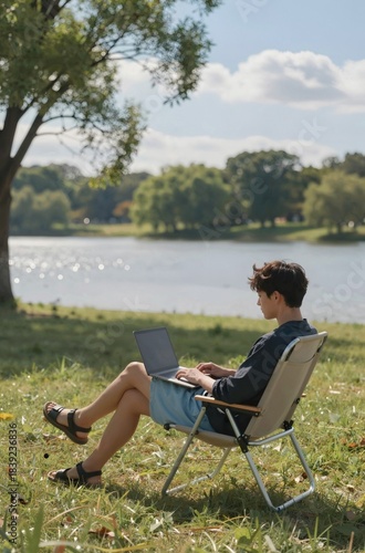man sitting on a bench with a laptop
