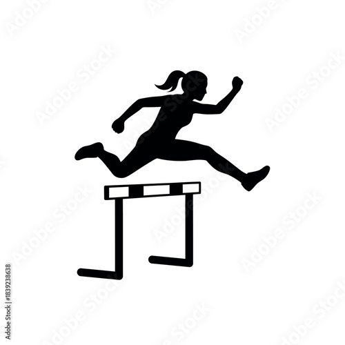 Silhouette of a female athlete jumping over a hurdle during a race.