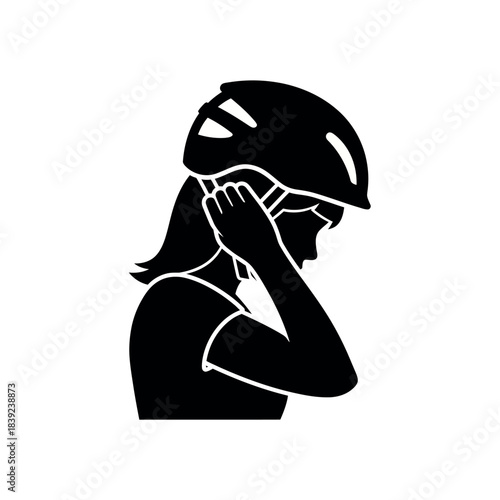 Silhouette of a person putting on a helmet.