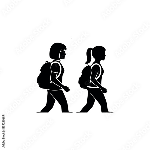 Two students walking with backpacks.