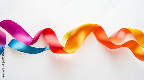 Colorful ribbon placed on a smooth white background for creative design and decoration purposes