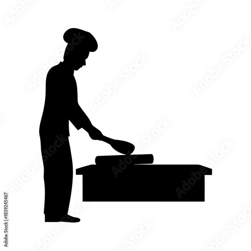 Chef in silhouette cooking on a griddle with spatula silhouette