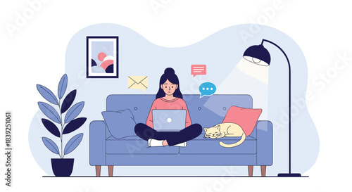 Woman works from home on her laptop sitting cross-legged on a cozy sofa with her cat sleeping beside her under a floor lamp.