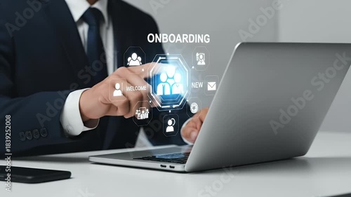 Close Up of Business Professional in Navy Suit Typing on Laptop with Onboarding Graphic in White Background