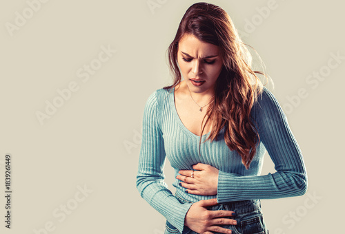 Woman suffering from abdominal pain. Painful disease feeling unwell. Ache concept. Stomach pain and others stomach disease concept