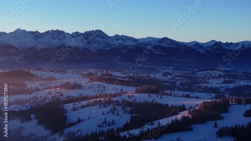 Misty sunrise in winter over Tatra Mountains, Podhale region, Poland