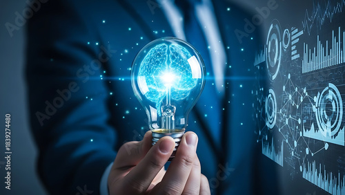 Businessman holding a glowing light bulb with a digital brain inside, symbolizing innovation, artificial intelligence, and cutting-edge technology amidst a futuristic data interface.