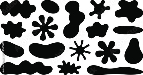 Collection of black organic blob shapes and starbursts on white background abstract irregular