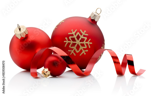 Three red Christmas decoration baubles and curling paper ribbon