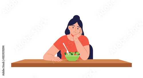 An unhappy and bored young woman sits at a table with a sad expression looking at a bowl of green salad for her diet.