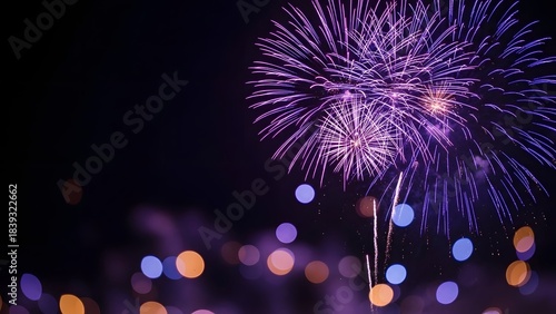 Vibrant purple fireworks exploding in a dark night sky over a blurred city