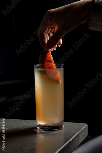 A delicious alcoholic cocktail at the bar. The bartender prepares cocktails