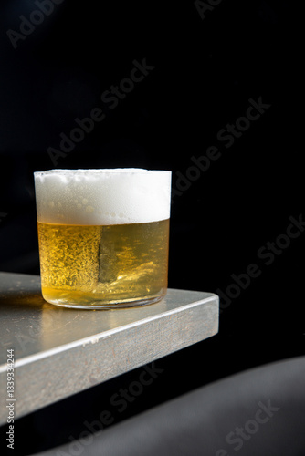 A delicious alcoholic cocktail at the bar. The bartender prepares cocktails
