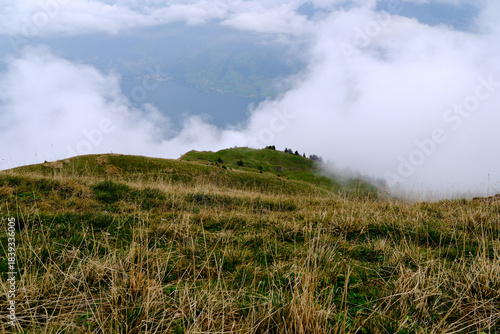 landscape of grassy hills on Mount Rigi with clouds