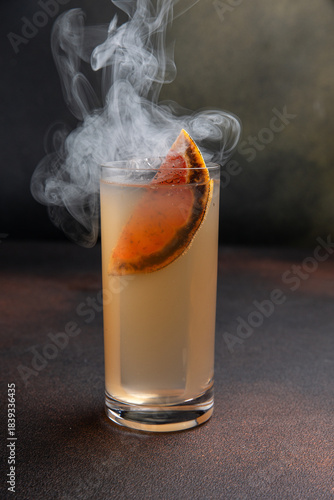 A delicious alcoholic cocktail at the bar. The bartender prepares cocktails