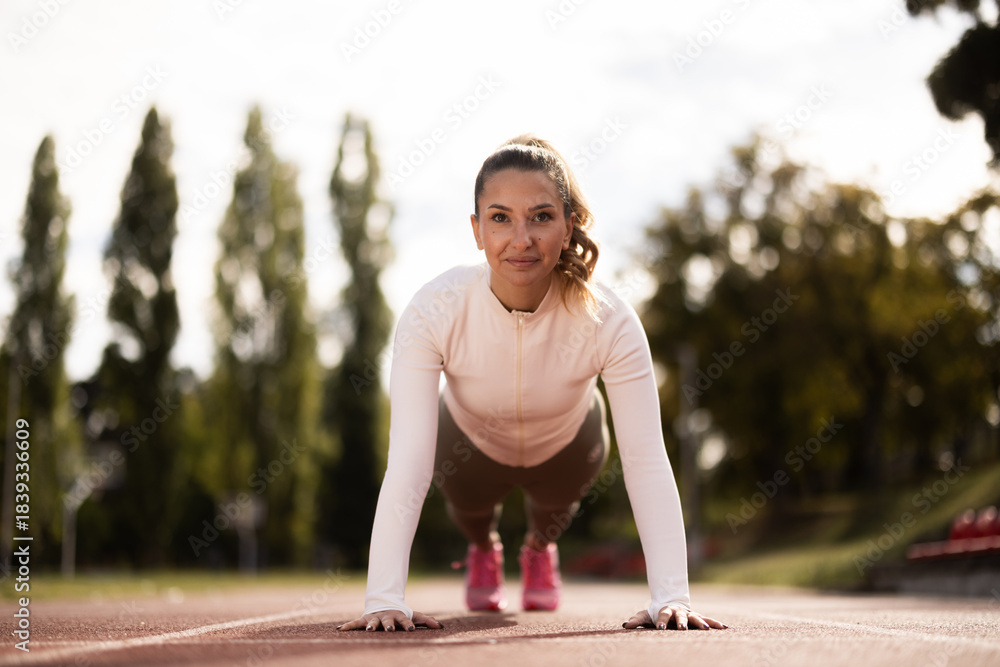 Fototapeta premium Woman Doing Push Up