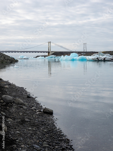 Bridge over Glacier Lagoon in Iceland with icebergs floating