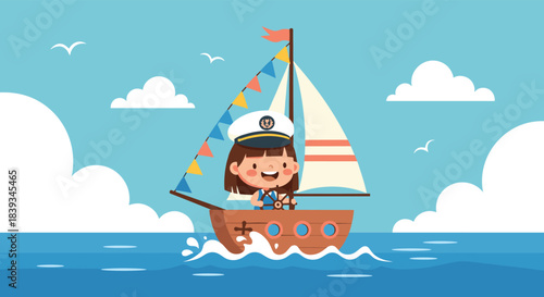 Happy little girl wearing a captain's hat and sailing a small wooden sailboat with colorful flags on the open blue ocean.
