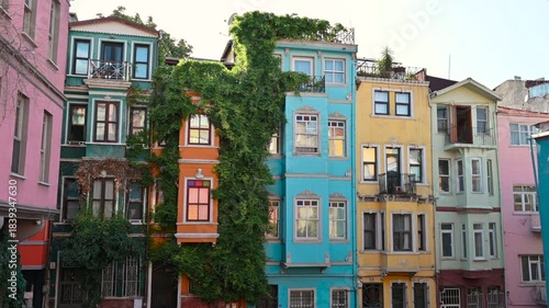Istanbul,Turkey,August 1,2025.Still footage of the colorful facades of the historic Balat neighborhood.Iconic in their vibrant colors, with climbing plants blowing in the wind. A beautiful summer day.