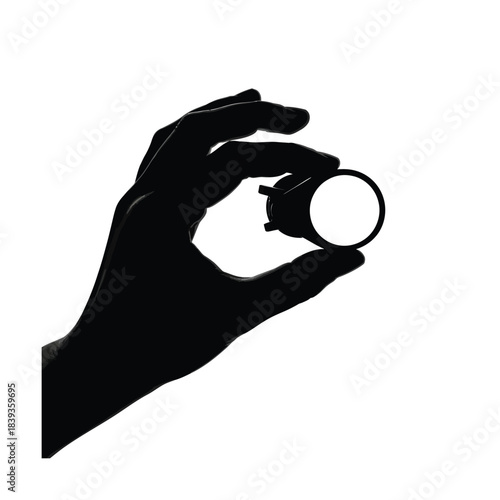 Hand holding small cylindrical object silhouette