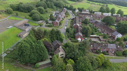 Wallpaper Mural Aerial drone view of Dodnaze housing estate in Hebden Bridge surrounded by fields and trees with the town in the distance Torontodigital.ca