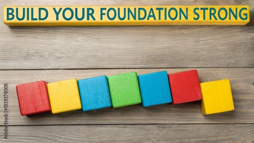 Colorful wooden blocks forming foundation of success