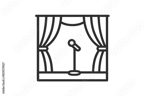 Stage setup with curtains and microphone in a venue ready for performance in the evening hours