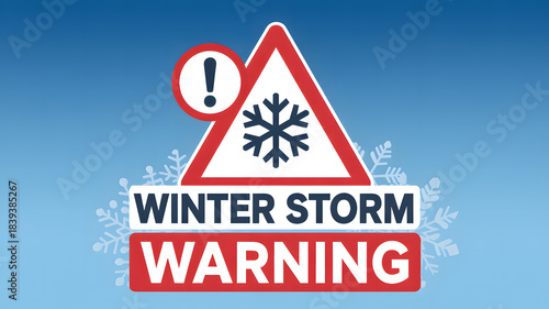 Winter storm warning road sign with snowflake and exclamation mark
