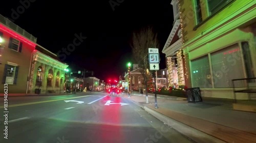 Discover the holiday lights in Charles Town, West Virginia while driving through the vibrant streets at night with colorful displays.