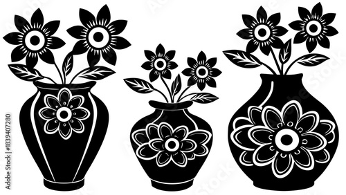 Three stylized black and white floral arrangements in decorative vases create a bold graphic design pattern