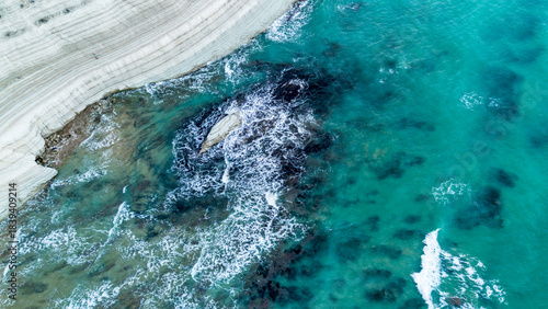 Fototapeta Naklejka Na Ścianę i Meble -  scala dei turchi Beautiful white beach from above drone shot pretty blue ocean sea 