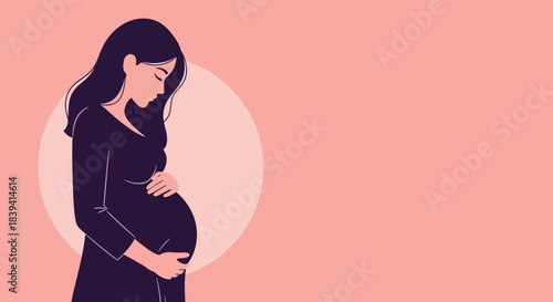 Beautiful pregnant woman tenderly holding her baby bump in profile view illustrating the concept of motherhood and pregnancy.