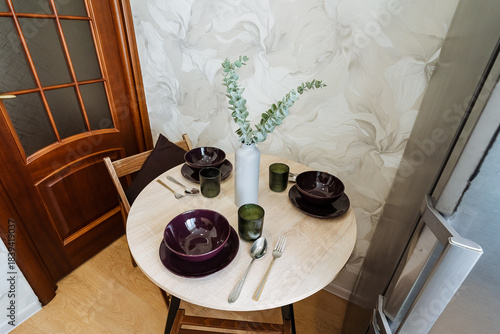 Marble Table Set With Ceramic Bowls And Green Glassware, Floral Wallpaper Backdrop, Wooden Chairs And Intimate Breakfast Or Tasting Setup Styled For Food Photographer, Cozy Hospitality Mood