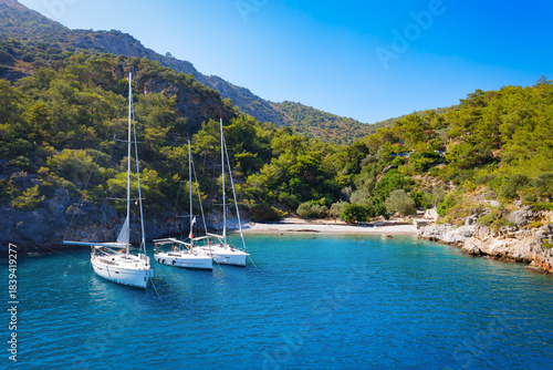Fototapeta Naklejka Na Ścianę i Meble -  Yachts at the Cold Water Bay near Oludeniz village, Fethiye district in Turkey