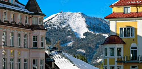 View from the main square in Mariazell towards the snow-covered peak of the Bürgeralpe with ski slope, Austria