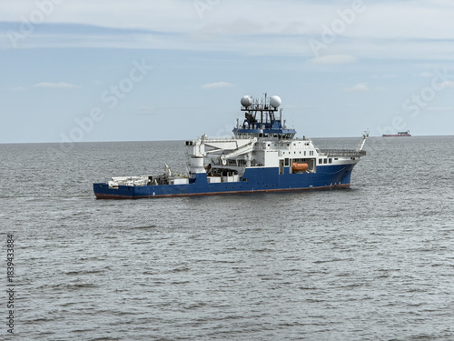 фотографія Research vessel anchored with satellite communication systems and scientific equ