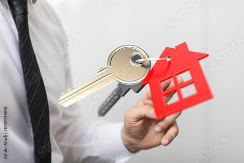 Real estate agent holding h...